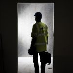 a man in a yellow vest